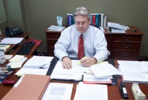 Jed Williams from HSFG sitting at desk